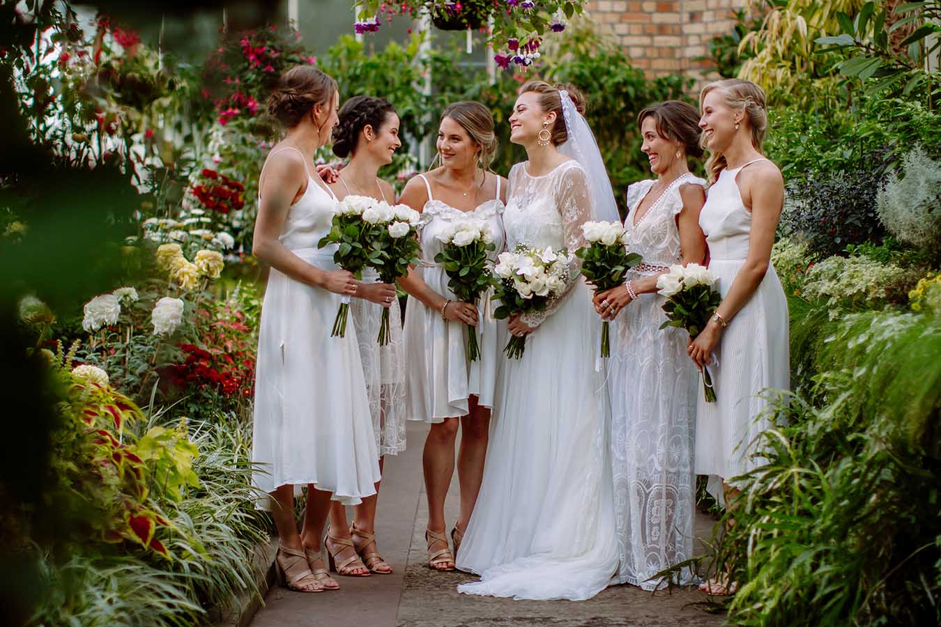 Auckland Wedding Photographer.Bride and bridesmaids at the bridal party outside Auckland Wintergardens