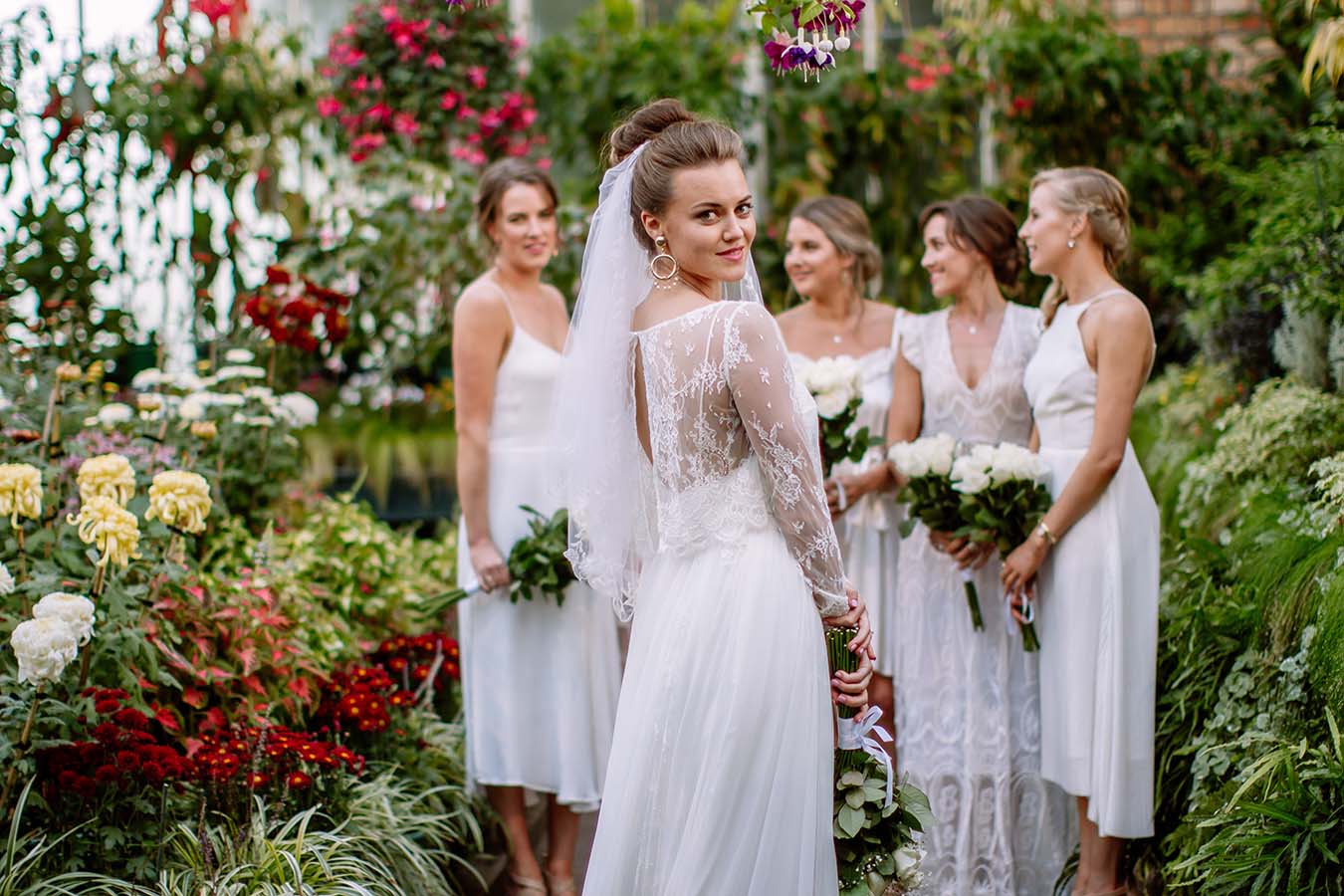 Auckland Wedding Photographer.Bride and bridesmaids at the bridal party outside Auckland Wintergardens
