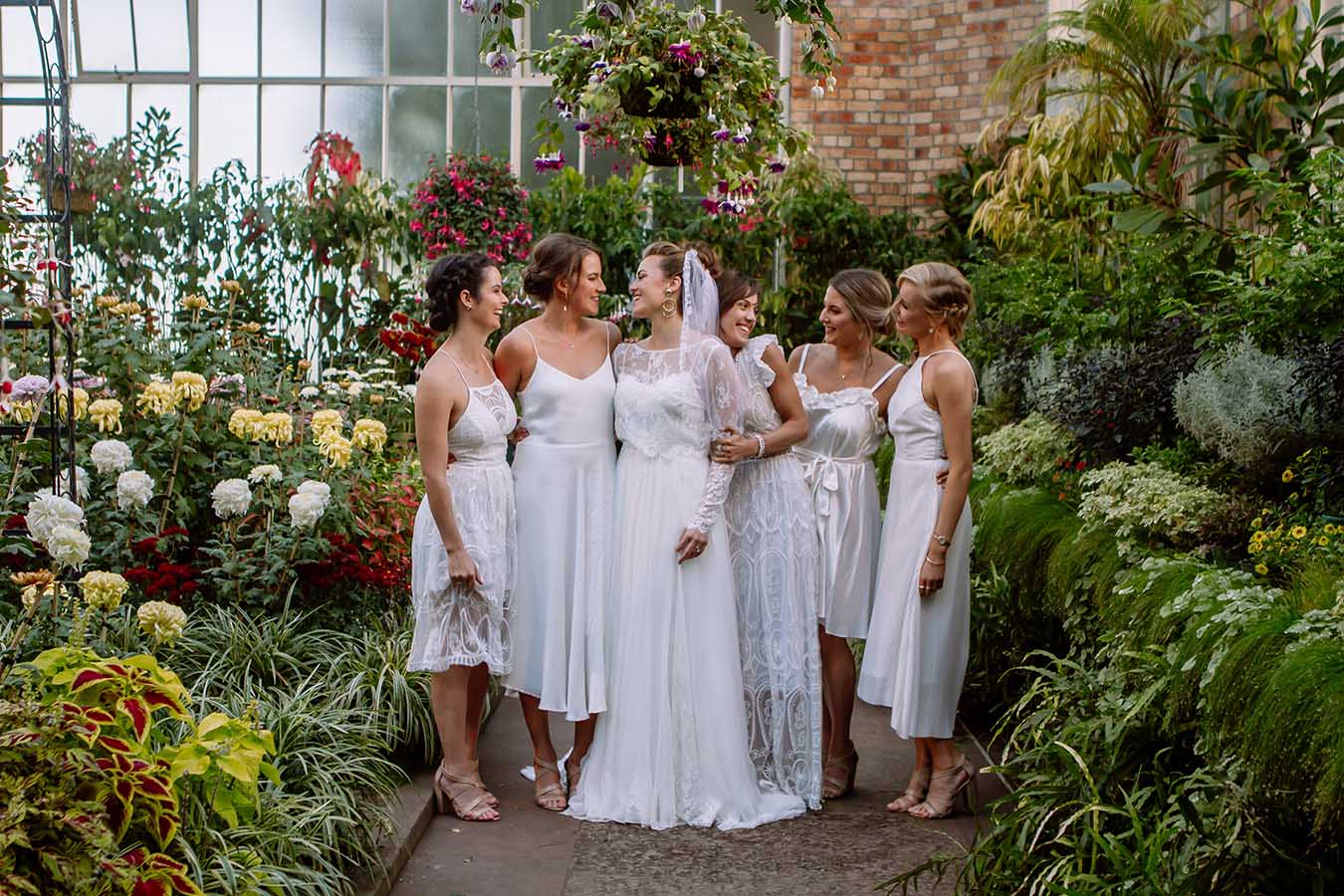 Auckland Wedding Photographer.Bride and bridesmaids at the bridal party outside Auckland Wintergardens