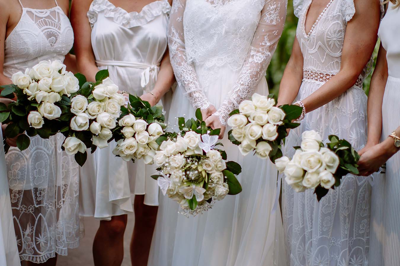 Auckland Wedding Photographer.flowers Bride and bridesmaids at the bridal party outside Auckland Wintergardens